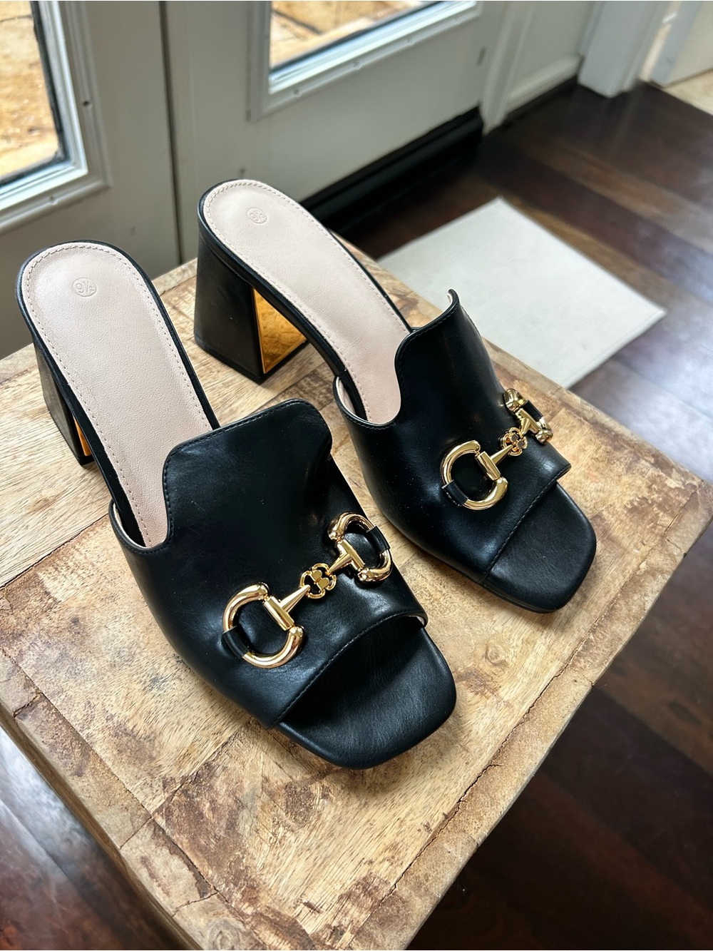 Black Leather Open-Toe Heeled Mules with Gold Hardware